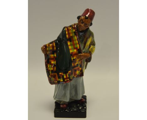 A Royal Doulton figure, Carpet Seller HN1464