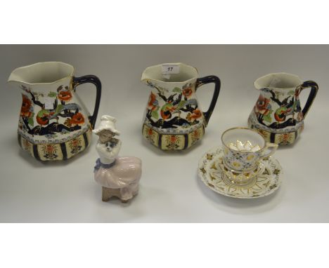 A graduated set of three Losol Ware Shanghai pattern jugs, printed mark; a German mustache cup; a Nao figure; etc.