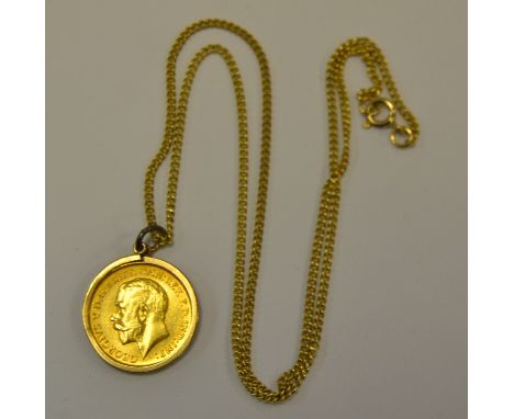 A 9ct. gold chain mounted with a 1926 half sovereign. ~9g