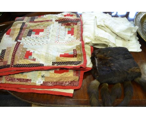 An early 20th patchwork double bed spread;  lace clothes;  muff