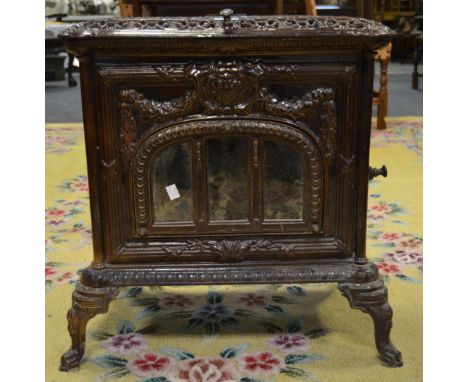 A French 'Le Select, Pardon, Paris' cast iron wood burning stove, burgundy enamel, c.1920