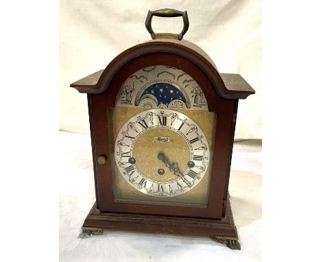 A reproduction Georgian style bracket clock in mahogany arch top case, with silvered and brass dial, ,moon phase to the arch,