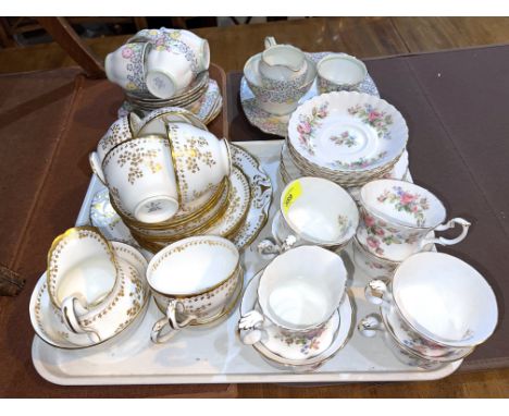 A Royal Albert part tea service 'Moss Rose'; a gilt 'New Chelsea' part tea service and another part tea service. 