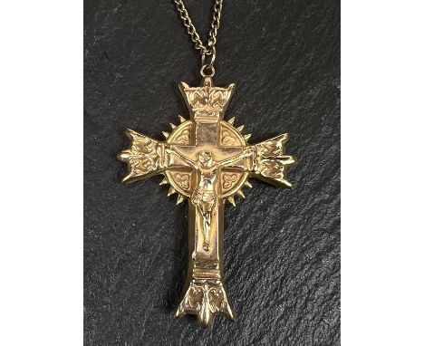 A 9 carat gold cross pendant; a chain stamped 375; another 9 carat pendant, 6.6gms gross. 