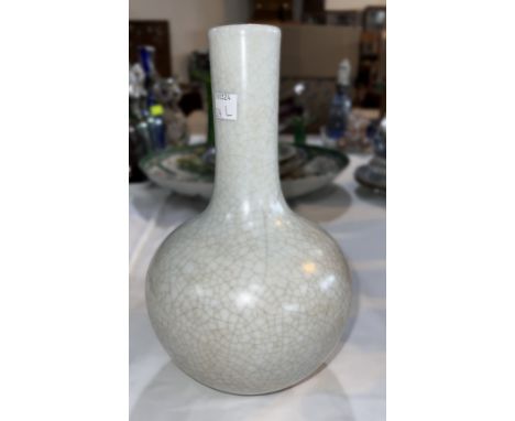 A Chinese crackle glaze bottle shaped vase in white, ht. 27cm, seal mark to base 