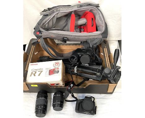 A Cannon E05 100D Digital SLR Camera; a Cannon lense 200m 75-300 mm; 18-55m lense; tripod; Bushnell Binoculars and a Ricoh Ca