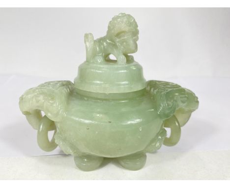 A Chinese jade coloured hardstone censor with hoop handles, mythical beast carved finial and side mounts, length 15cm 