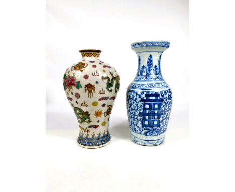 A modern Chinese dragon decorated vase with seal mark to base, height 23cm and a Chinese blue and white vase, height 25cm 