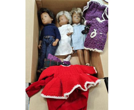 Three Mid 20th century Sasha dolls, two girls and one boy with extra clothing 