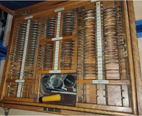 A light oak opticians set with varying focuses. 