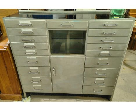 An Art Deco dentists cabinet with multiple small drawers and glass shelves&nbsp; 