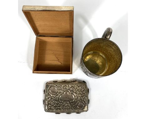 An engine turned cigarette box, Birmingham 1941; a hallmarked silver rectangular embossed bonbon dish, Chester 1896; an India