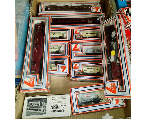 A Lima Boxed locomotive, boxed Lima coaches, trucks, crane etc. 