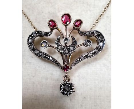 A Victorian yellow metal pendant necklace 16", set with rose cut diamonds and garnets, chain stamped 9ct, 4.4gms 
