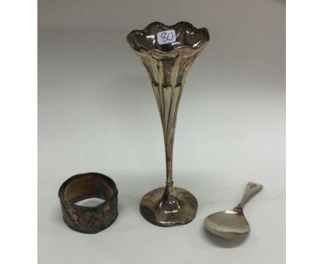 A tapering silver spill vase together with a Chinese silver napkin ring and caddy spoon. Various dates and makers. Approx. 11