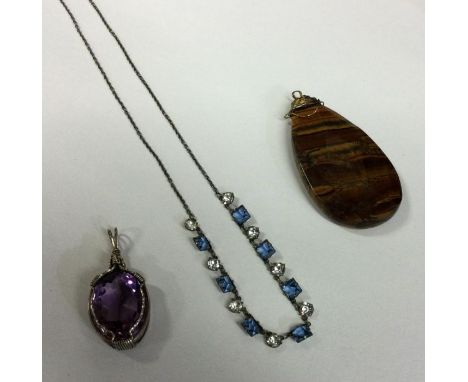 A stylish silver necklace together with an amethyst pendant etc. Est. £15 - £20.