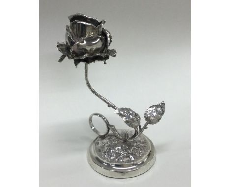 An unusual novelty silver chamber stick in the form of a flower on circular tapering base. London 1890. By JD&amp;S. Approx. 