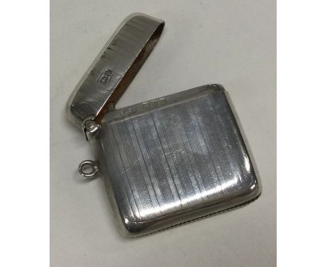 CHESTER: An engine turned silver vesta case with hinged top. 1920. Approx. 28 grams. Est. £20 - £30.