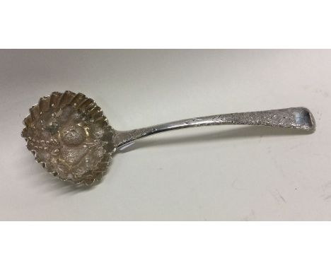 A pierced silver sauce ladle decorated with fruit. London. By TH. Approx. 47 grams. Est. £40 - £50.