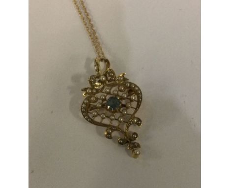 An attractive Victorian 15 carat gold pendant with pearl decoration on fine link chain. Approx. 5 grams. Est. £200 - £300.