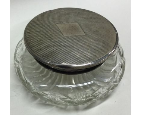 A heavy hobnail cut and silver mounted powder jar with engine turned decoration. Birmingham 1947. Est. £25 - £30.