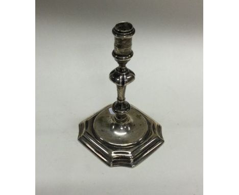 A good Georgian silver taper stick with cut corners of typical form. London 1729. By IB. Approx. 123 grams. Est. £400 - £600.