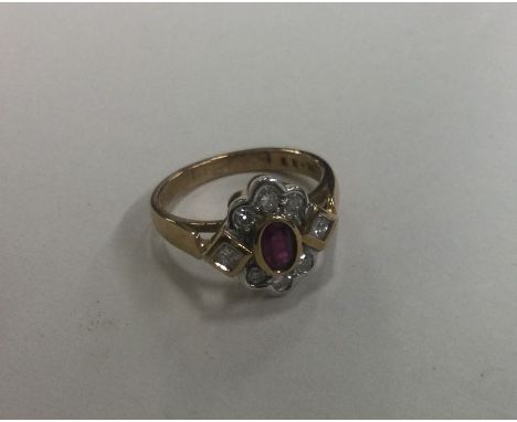 A good quality ruby and diamond daisy head cluster ring with princess cut shoulders. Approx. 4 grams. Est. £200 - £300.