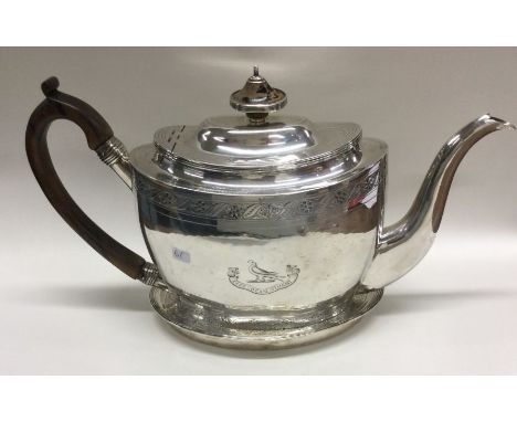 A good Georgian silver teapot on stand with bright cut decoration. London 1802. Approx. 796 grams. Est. £500 - £600.