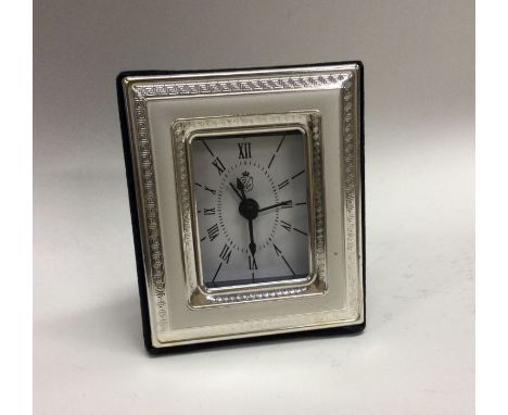 A modern silver mounted mantle clock with felt back. Approx. 103 grams. Est. £10 - £20.