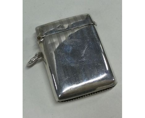 CHESTER: A rectangular engine turned silver vesta case. Approx. 24 grams. Est. £20 - £30.