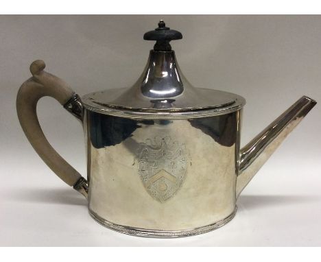 HESTER BATEMAN: A good shaped Georgian silver teapot with tapering lid to shield shaped engraved armorial to beaded rim. Lond