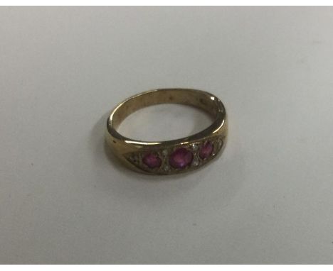 An attractive Victorian style ruby and diamond nine stone ring. Approx. 3 grams. Est. £80 - £120.