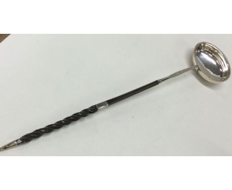 A good large Georgian silver punch ladle dated 1784 with whalebone handle. London. Approx. 53 grams. Est. £50 - £80.