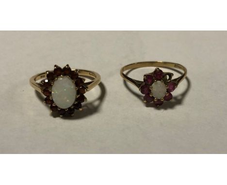 Two 9 carat opal rings. Approx. 4 grams. Est. £30 - £40.