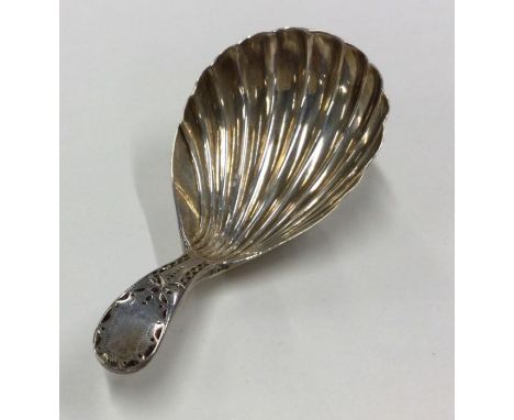 A Georgian OE pattern silver caddy spoon with fluted bowl and bright cut handle. London. Est. £30 - £50.