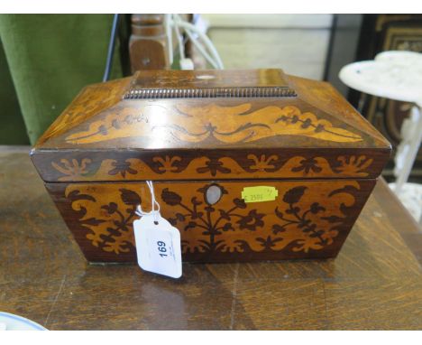 A Regency rosewood and amboyna inlaid tea caddy, of sarcophagus form, enclosing two lidded compartments, 23 cm wide 