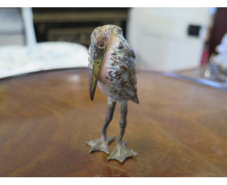 A cold painted bronze figure of a stork, unmarked, 9 cm high 