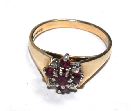 A ruby and cubic zirconia ring set in 9 carat gold 