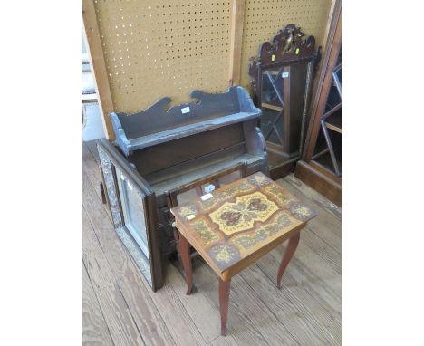 An oak hanging cabinet, with shelf over a pair of panelled doors, 60 cm wide, a fret carved wall mirror, a Victorian toilet m