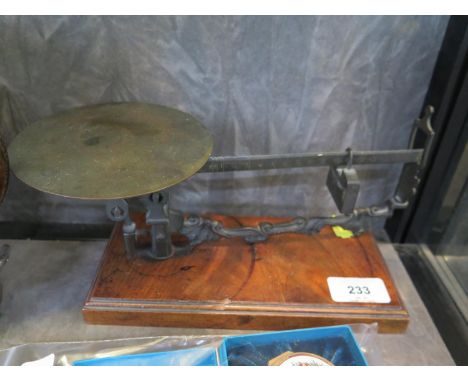 A Victorian bronze beam balance on a walnut base, 25.5 cm wide 