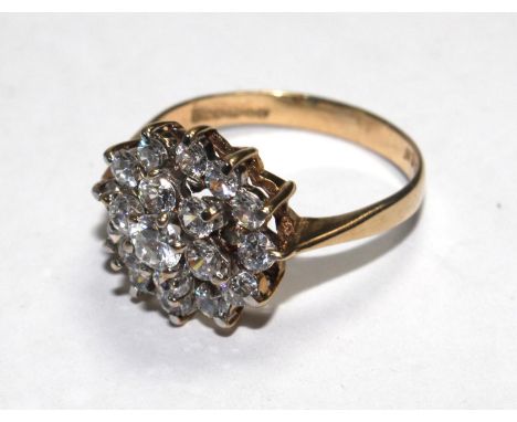 A 9 carat gold ring set with faux diamonds 