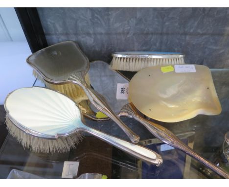 A silver plated hand mirror and brush together with a pair of silver and enamel brushes, Birmingham 1939, and a shell dish on