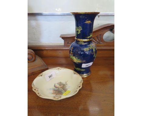 A Carlton Ware Chinese style powder blue and lustre vase, 21 cm high, and a continental dish depicting a peacock (2) 