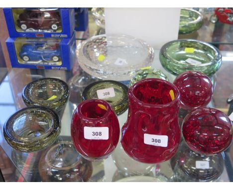 A Whitefriars knobbly vase in ruby red, 12 cm high, another ruby red vase with original label, 9.5 cm high, five air bubble d