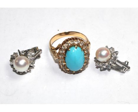 A pair of 18 carat white gold pearl earrings and a turquoise and gold coloured metal ring 