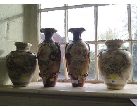 A pair of Satsuma vases, depicting figures playing, 24.5 cm high and another pair of Japanese vases depicting birds and flowe