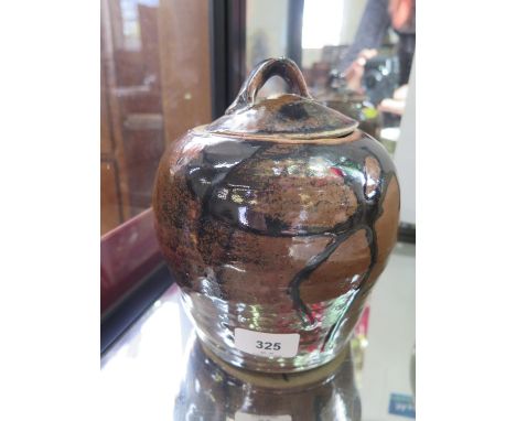 A Trevor Corser lidded pot, in a brown glaze, with Leach Pottery and personal stamps, 20 cm high 