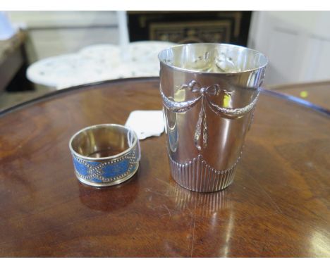 A Norwegian silver and enamel napkin ring, by Marius Hammer, marked 900, and a Continental silver beaker with swag decoration