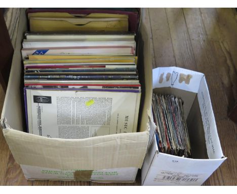 A collection of vinyl records, including singles by Blondie, Tom Jones (Delilah), Abba (Waterloo) and others, and long playin