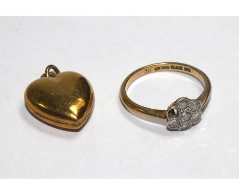 A diamond posy ring set in 18 carat gold (one stone missing) and a heart pendant (2) 